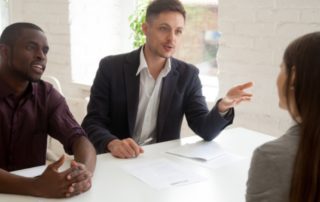 Three people having a discussion